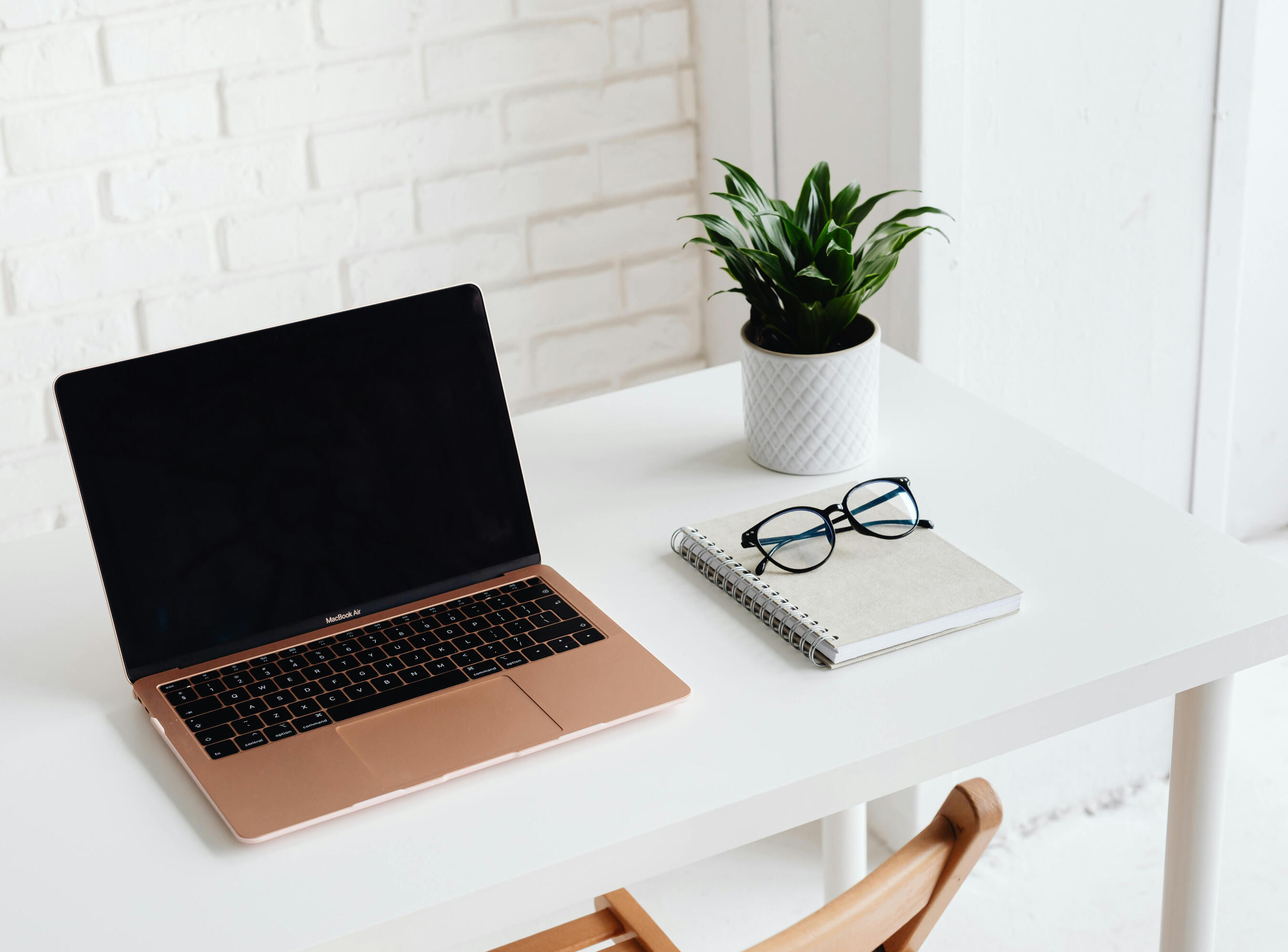 desk laptop notebook and glasses
